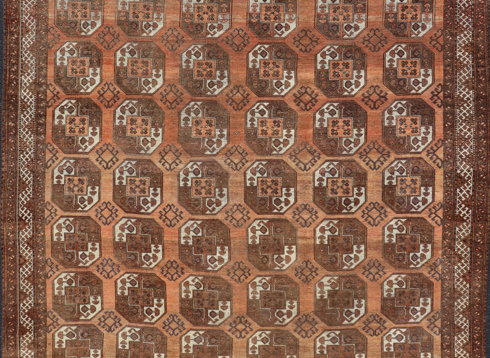 Measures:9'7 x 12'10 Antique Turkomen Ersari Rug in Wool with Repeating Gul Design in Orange, Brown. Keivan Woven Arts; rug EMB - 9594 - 13519, country of origin / type: Turkestan / Ersari, circa 1930s. This Ersari rug has been hand - knotted in th... - Keivan Woven ArtsEMB - 9594 - 13519 - 15613Rug