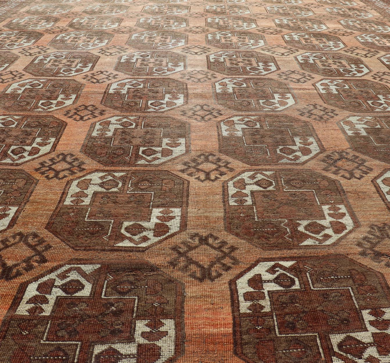 Measures:9'7 x 12'10 Antique Turkomen Ersari Rug in Wool with Repeating Gul Design in Orange, Brown. Keivan Woven Arts; rug EMB - 9594 - 13519, country of origin / type: Turkestan / Ersari, circa 1930s. This Ersari rug has been hand - knotted in th... - Keivan Woven ArtsEMB - 9594 - 13519 - 15613Rug