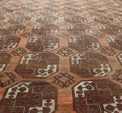 Measures:9'7 x 12'10 Antique Turkomen Ersari Rug in Wool with Repeating Gul Design in Orange, Brown. Keivan Woven Arts; rug EMB - 9594 - 13519, country of origin / type: Turkestan / Ersari, circa 1930s. This Ersari rug has been hand - knotted in th... - Keivan Woven ArtsEMB - 9594 - 13519 - 15613Rug