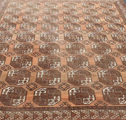Measures:9'7 x 12'10 Antique Turkomen Ersari Rug in Wool with Repeating Gul Design in Orange, Brown. Keivan Woven Arts; rug EMB - 9594 - 13519, country of origin / type: Turkestan / Ersari, circa 1930s. This Ersari rug has been hand - knotted in th... - Keivan Woven ArtsEMB - 9594 - 13519 - 15613Rug