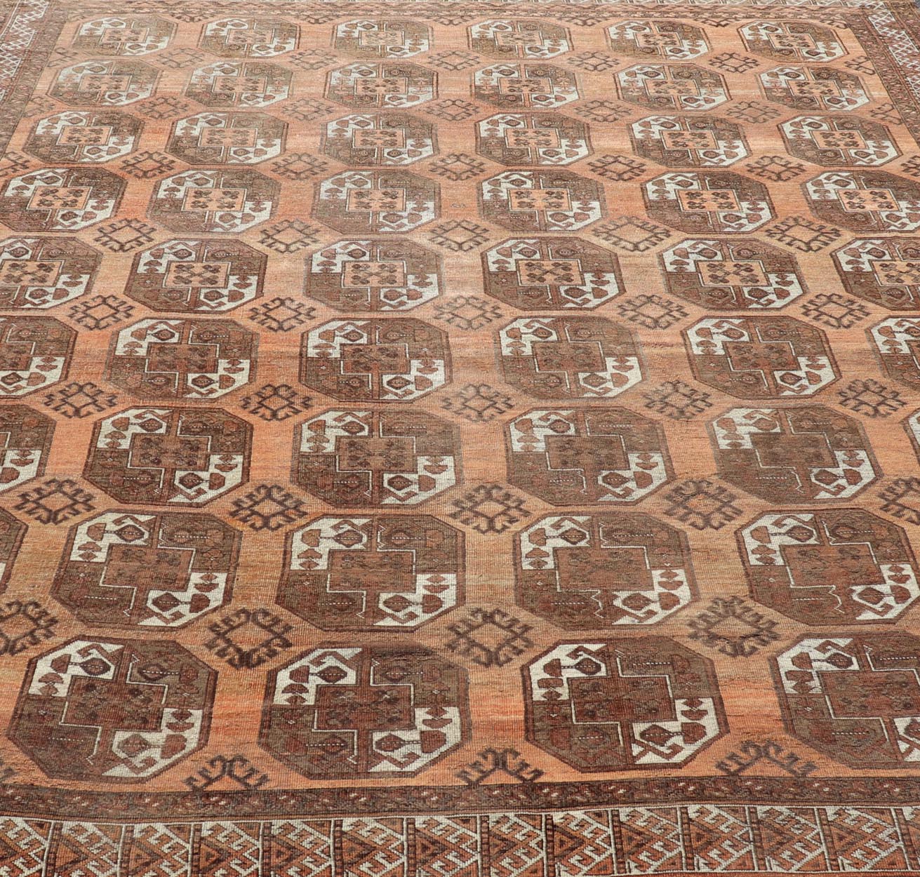 Measures:9'7 x 12'10 Antique Turkomen Ersari Rug in Wool with Repeating Gul Design in Orange, Brown. Keivan Woven Arts; rug EMB - 9594 - 13519, country of origin / type: Turkestan / Ersari, circa 1930s. This Ersari rug has been hand - knotted in th... - Keivan Woven ArtsEMB - 9594 - 13519 - 15613Rug