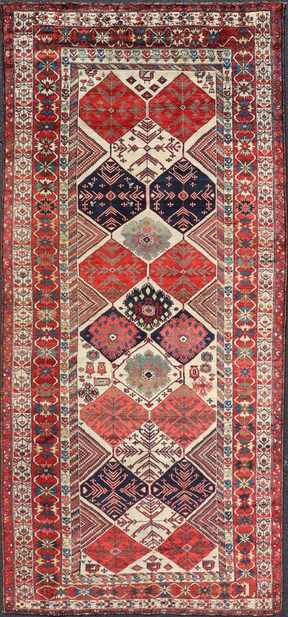 Antique Hand - Knotted Persian Bakhtiari Gallery Rug in Wool with Diamond Design This antique Persian Bakhtiari rug has been hand - knotted in wool and features an all - over sub - geometric diamond design rendered in multicolor, set upon an ivory bac... - Keivan Woven ArtsEMB - 9595 - P13521 - 15619Rug