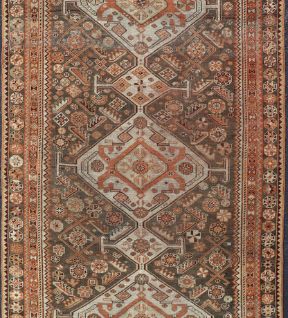 Antique Hand - Knotted Persian Shiraz in Wool with All - Over Medallion Design This antique Persian Shiraz rug has been hand - knotted in wool and features an all - over sub - geometric design rendered in multicolor. A complementary, multi - tiered border ... - Keivan Woven ArtsEMB - 9606 - P13865 - 15649Rug