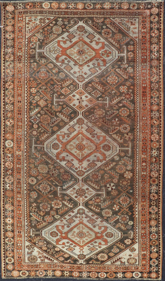 Antique Hand - Knotted Persian Shiraz in Wool with All - Over Medallion Design This antique Persian Shiraz rug has been hand - knotted in wool and features an all - over sub - geometric design rendered in multicolor. A complementary, multi - tiered border ... - Keivan Woven ArtsEMB - 9606 - P13865 - 15649Rug