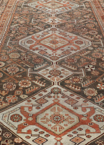 Antique Hand - Knotted Persian Shiraz in Wool with All - Over Medallion Design This antique Persian Shiraz rug has been hand - knotted in wool and features an all - over sub - geometric design rendered in multicolor. A complementary, multi - tiered border ... - Keivan Woven ArtsEMB - 9606 - P13865 - 15649Rug