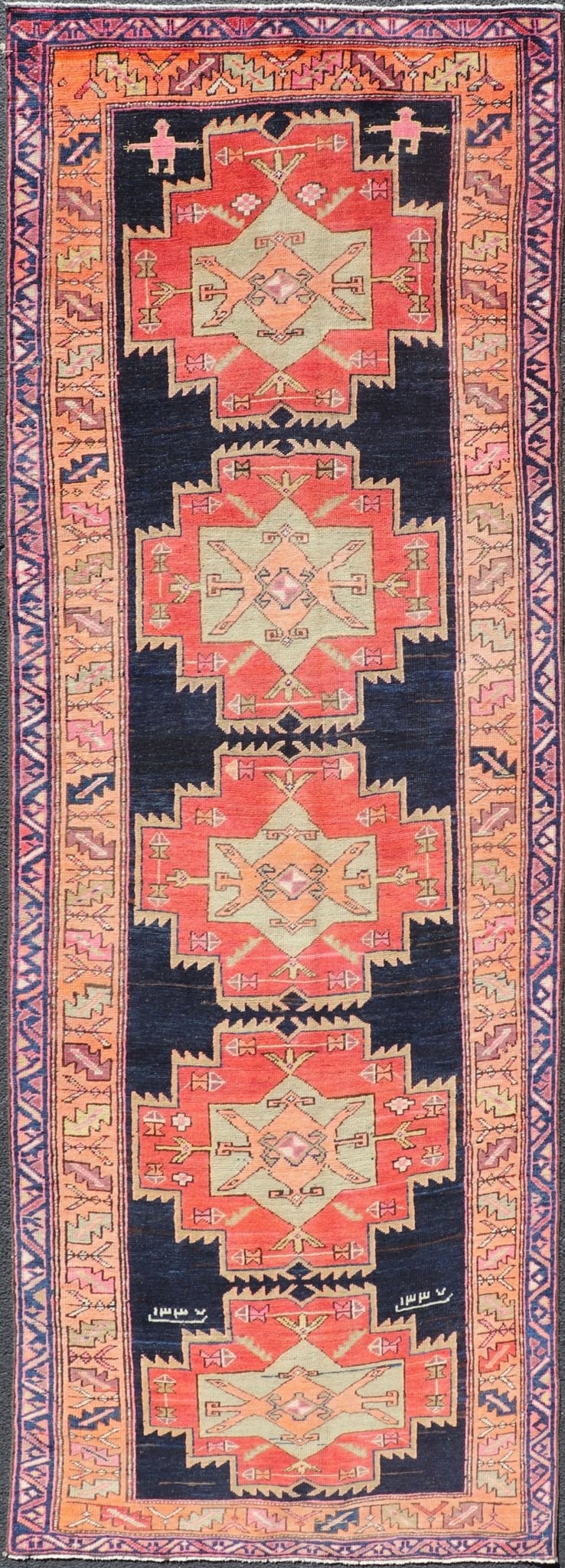 Long Hand - Knotted Antique Persian Azerbaijan Runner in Wool with Medallions This antique Persian Azerbaijan styled runner has been hand - knotted in wool. The rug features a sub - geometric medallion design, and is enclosed within a complementary, ... - Keivan Woven ArtsEMB - 9608 - P13508 - 15661Rug