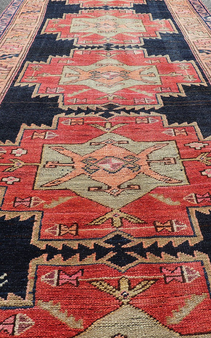 Long Hand - Knotted Antique Persian Azerbaijan Runner in Wool with Medallions This antique Persian Azerbaijan styled runner has been hand - knotted in wool. The rug features a sub - geometric medallion design, and is enclosed within a complementary, ... - Keivan Woven ArtsEMB - 9608 - P13508 - 15661Rug