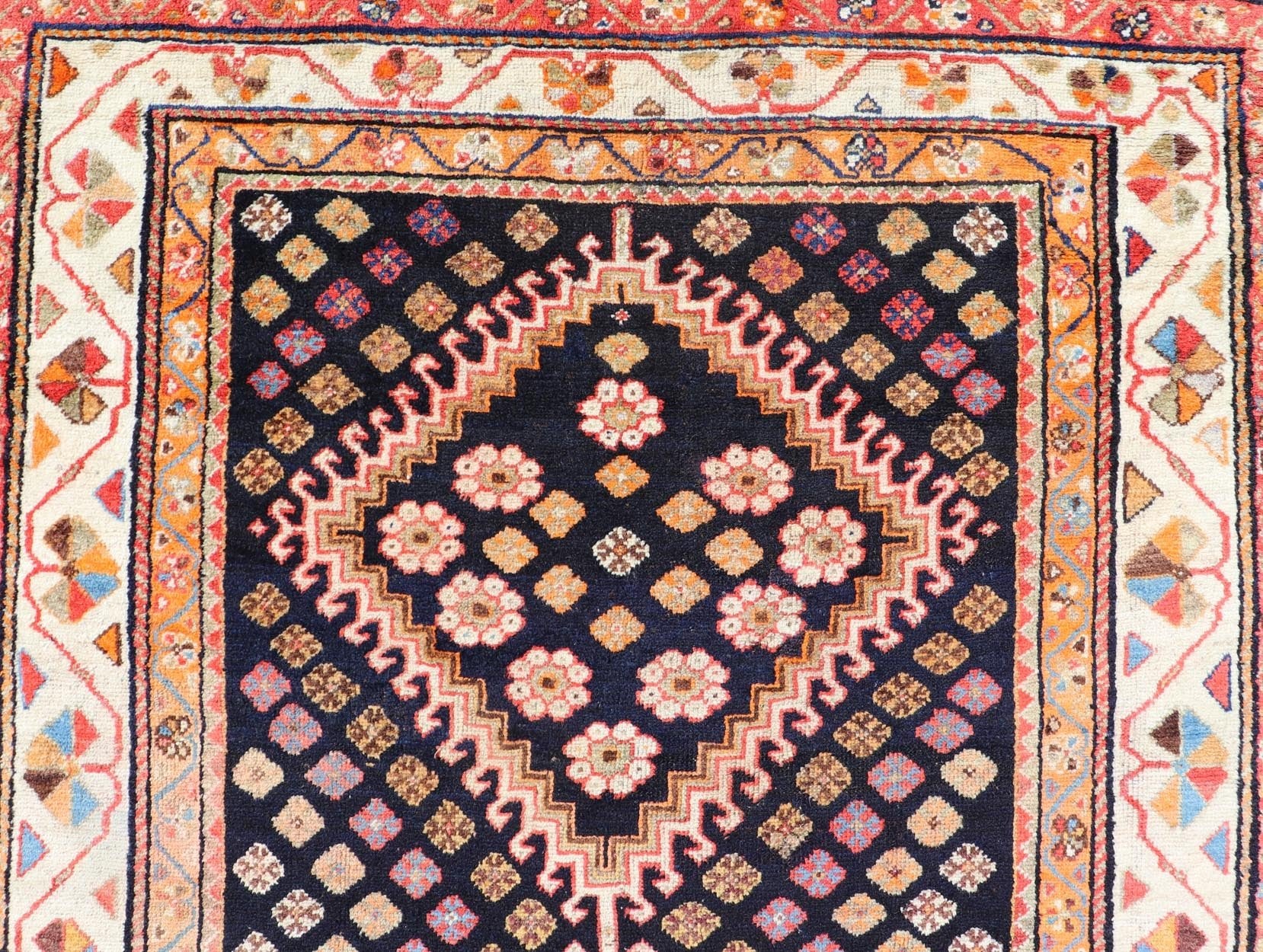 Antique Persian Tribal Shiraz in Wool with Tribal Medallion Design This antique Persian Shiraz rug has been hand - knotted in wool and features a sub - geometric tribal medallion design rendered in multicolor tones. A complementary, multi - tiered bor... - Keivan Woven ArtsEMB - 9610 - P13893 - 15929Rug