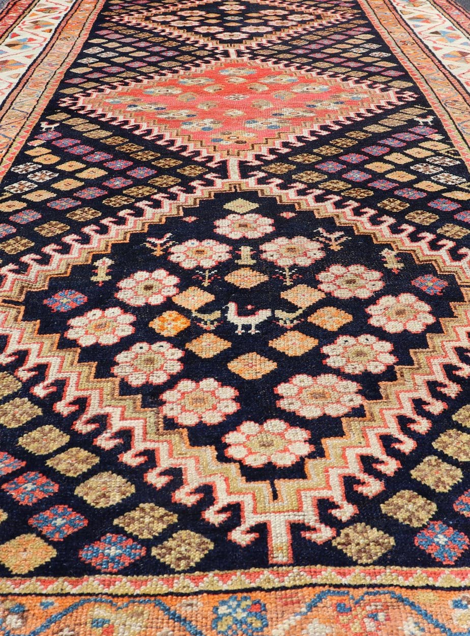 Antique Persian Tribal Shiraz in Wool with Tribal Medallion Design This antique Persian Shiraz rug has been hand - knotted in wool and features a sub - geometric tribal medallion design rendered in multicolor tones. A complementary, multi - tiered bor... - Keivan Woven ArtsEMB - 9610 - P13893 - 15929Rug