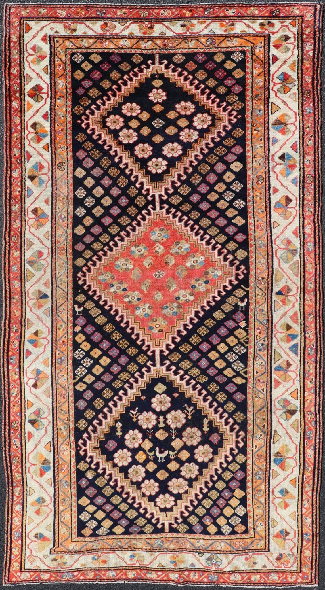 Antique Persian Tribal Shiraz in Wool with Tribal Medallion Design This antique Persian Shiraz rug has been hand - knotted in wool and features a sub - geometric tribal medallion design rendered in multicolor tones. A complementary, multi - tiered bor... - Keivan Woven ArtsEMB - 9610 - P13893 - 15929Rug