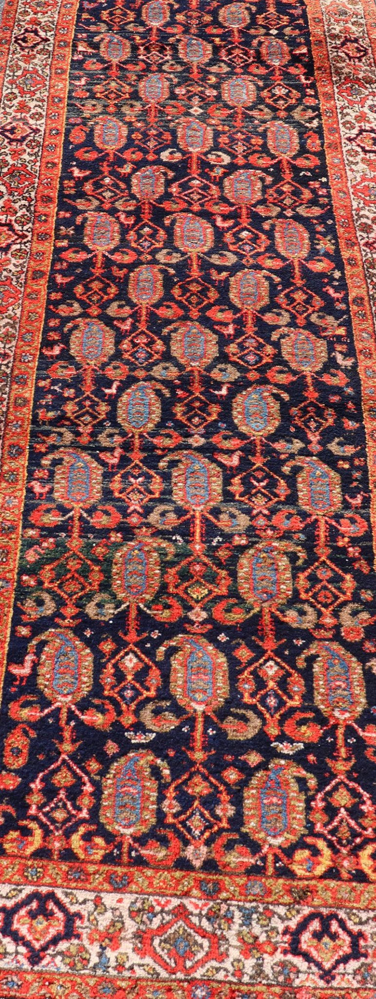 Long Antique Persian Hamadan Runner with All - Over Sub - Geometric Design Measures: 3'3 x 15'2. This 1920's Persian Hamadan runner features vivid shades of navy, blue, red - orange, green and small accents and ivory. The field design is a uniq... - Keivan Woven ArtsEMB - 9612 - P13871 - 15935Rug