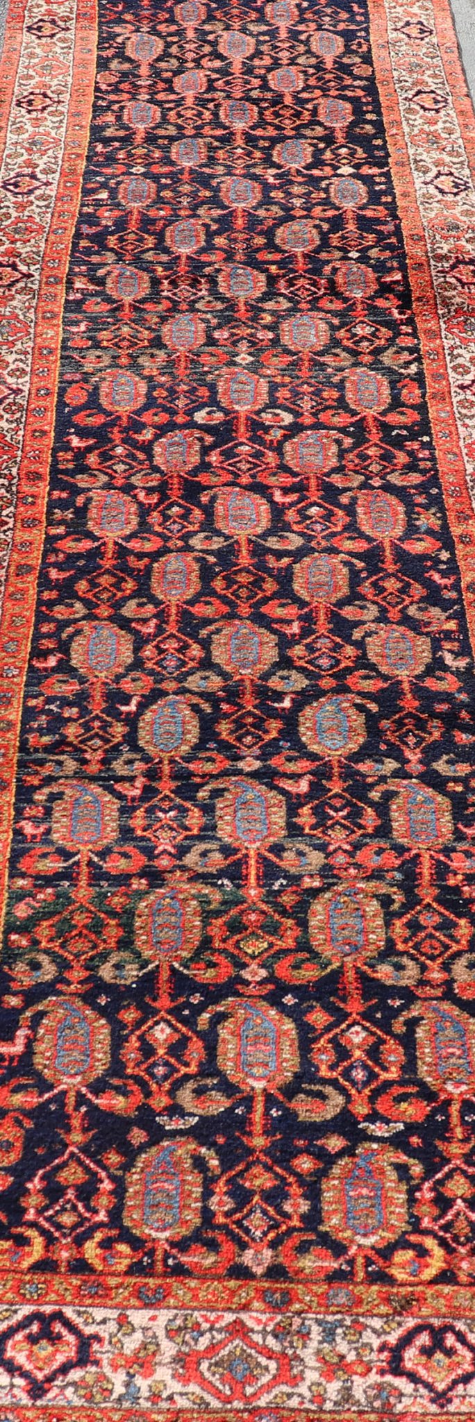 Long Antique Persian Hamadan Runner with All - Over Sub - Geometric Design Measures: 3'3 x 15'2. This 1920's Persian Hamadan runner features vivid shades of navy, blue, red - orange, green and small accents and ivory. The field design is a uniq... - Keivan Woven ArtsEMB - 9612 - P13871 - 15935Rug