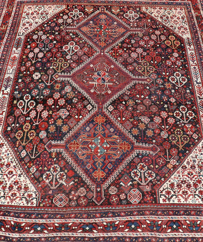 Antique Hand - Knotted Persian Qashqai Rug in Wool with All - Over Tribal Design This antique Persian Qashqai rug has been hand - knotted in wool and features an all - over sub - geometric design rendered in multicolor. A complementary, multi - tiered borde... - Keivan Woven ArtsEMB - 9628 - P13856 - 16007Rug