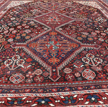 Antique Hand - Knotted Persian Qashqai Rug in Wool with All - Over Tribal Design This antique Persian Qashqai rug has been hand - knotted in wool and features an all - over sub - geometric design rendered in multicolor. A complementary, multi - tiered borde... - Keivan Woven ArtsEMB - 9628 - P13856 - 16007Rug