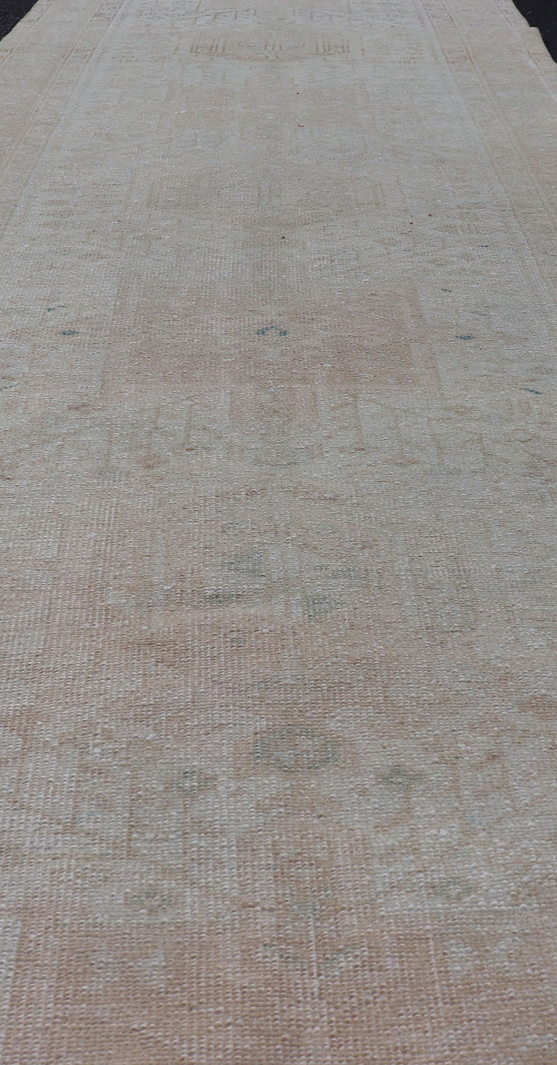 Vintage Muted Persian Karadjeh Runner with Medallions in Brown, Tan, Taupe. Keivan Woven Arts / rug EMB - 9632 - P13581, country of origin / type: Iran / Karadjeh, circa mid - 20th century This Persian Karajeh from the mid - 20th century bears an exquis... - Keivan Woven ArtsEMB - 9632 - P13581 - 16025Rug