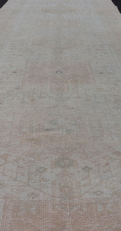 Vintage Muted Persian Karadjeh Runner with Medallions in Brown, Tan, Taupe. Keivan Woven Arts / rug EMB - 9632 - P13581, country of origin / type: Iran / Karadjeh, circa mid - 20th century This Persian Karajeh from the mid - 20th century bears an exquis... - Keivan Woven ArtsEMB - 9632 - P13581 - 16025Rug