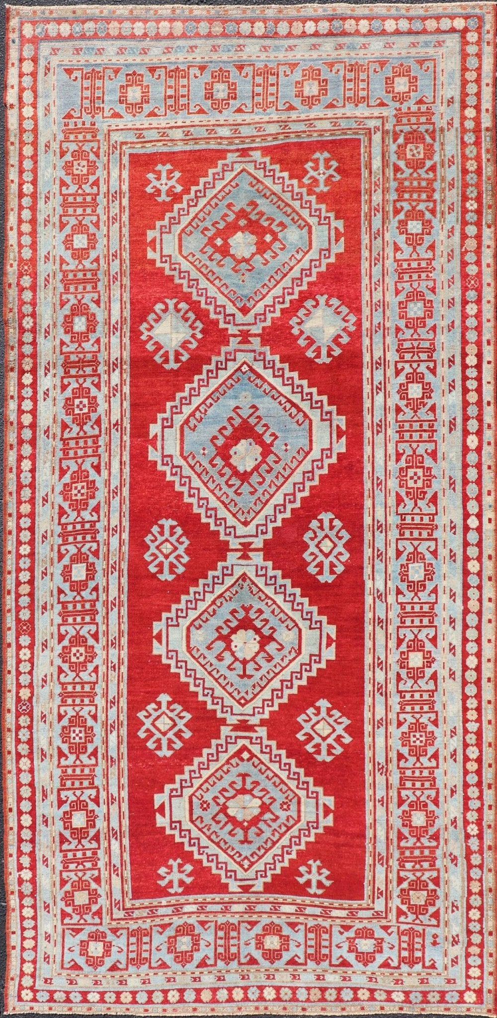 Antique Caucasian Kazak Gallery Rug in Brilliant Red with Geometric Design Tribal geometric medallion design Kazak antique rug, antique Caucasian from Caucasus Region with a beautiful red background in multi - colors, Keivan Woven Arts / rug E... - Keivan Woven ArtsEMB - 9637 - P13567 - 16037Rug
