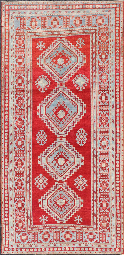 Antique Caucasian Kazak Gallery Rug in Brilliant Red with Geometric Design Tribal geometric medallion design Kazak antique rug, antique Caucasian from Caucasus Region with a beautiful red background in multi - colors, Keivan Woven Arts / rug E... - Keivan Woven ArtsEMB - 9637 - P13567 - 16037Rug