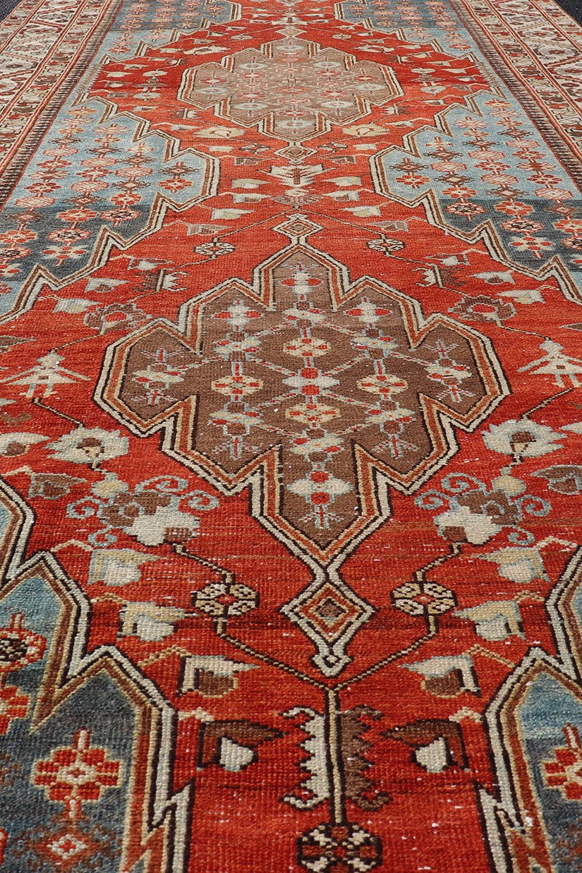 Antique Hamadan Gallery Rug with Geometric Medallions in Red, Blue and Brown This unique Persian Hamadan Gallery rug features an exquisite design composed of a vertical arrangement of red and brown geometric medallions surrounded by a variety of... - Keivan Woven ArtsEMB - 9639 - P13857 - 16043Rug