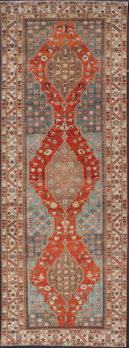 Antique Hamadan Gallery Rug with Geometric Medallions in Red, Blue and Brown This unique Persian Hamadan Gallery rug features an exquisite design composed of a vertical arrangement of red and brown geometric medallions surrounded by a variety of... - Keivan Woven ArtsEMB - 9639 - P13857 - 16043Rug