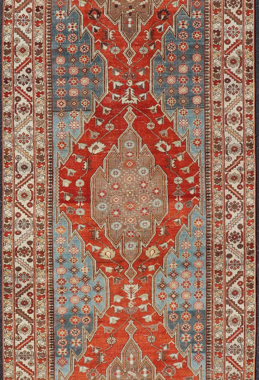 Antique Hamadan Gallery Rug with Geometric Medallions in Red, Blue and Brown This unique Persian Hamadan Gallery rug features an exquisite design composed of a vertical arrangement of red and brown geometric medallions surrounded by a variety of... - Keivan Woven ArtsEMB - 9639 - P13857 - 16043Rug