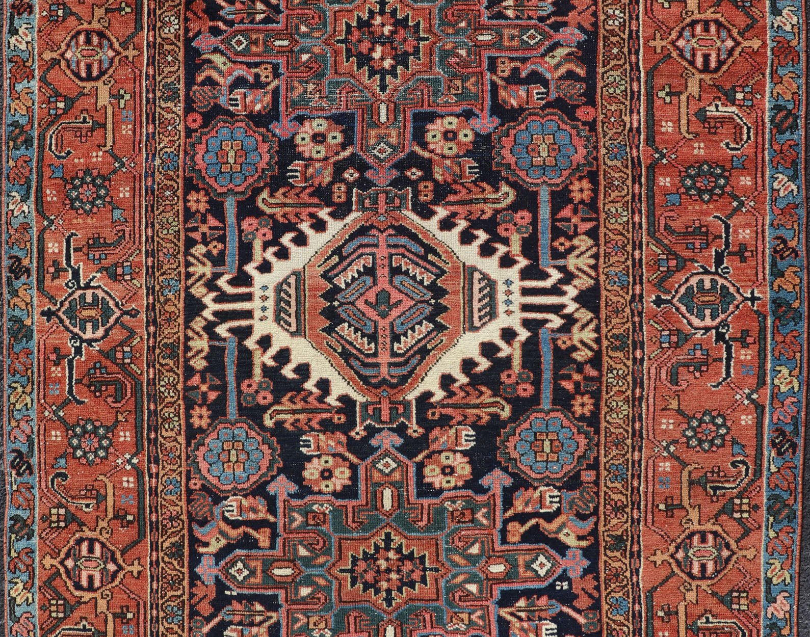 Antique Persian Heriz with Medallion Design in Ivory, Dark Blue & Jewel Tones This lovely Antique Heriz rug, hailing from northwestern Iran (circa 1920s), features a central medallion design surrounded by exquisitely defined geometric motifs. Th... - Keivan Woven ArtsEMB - 9641 - P13855 - 16055Rug