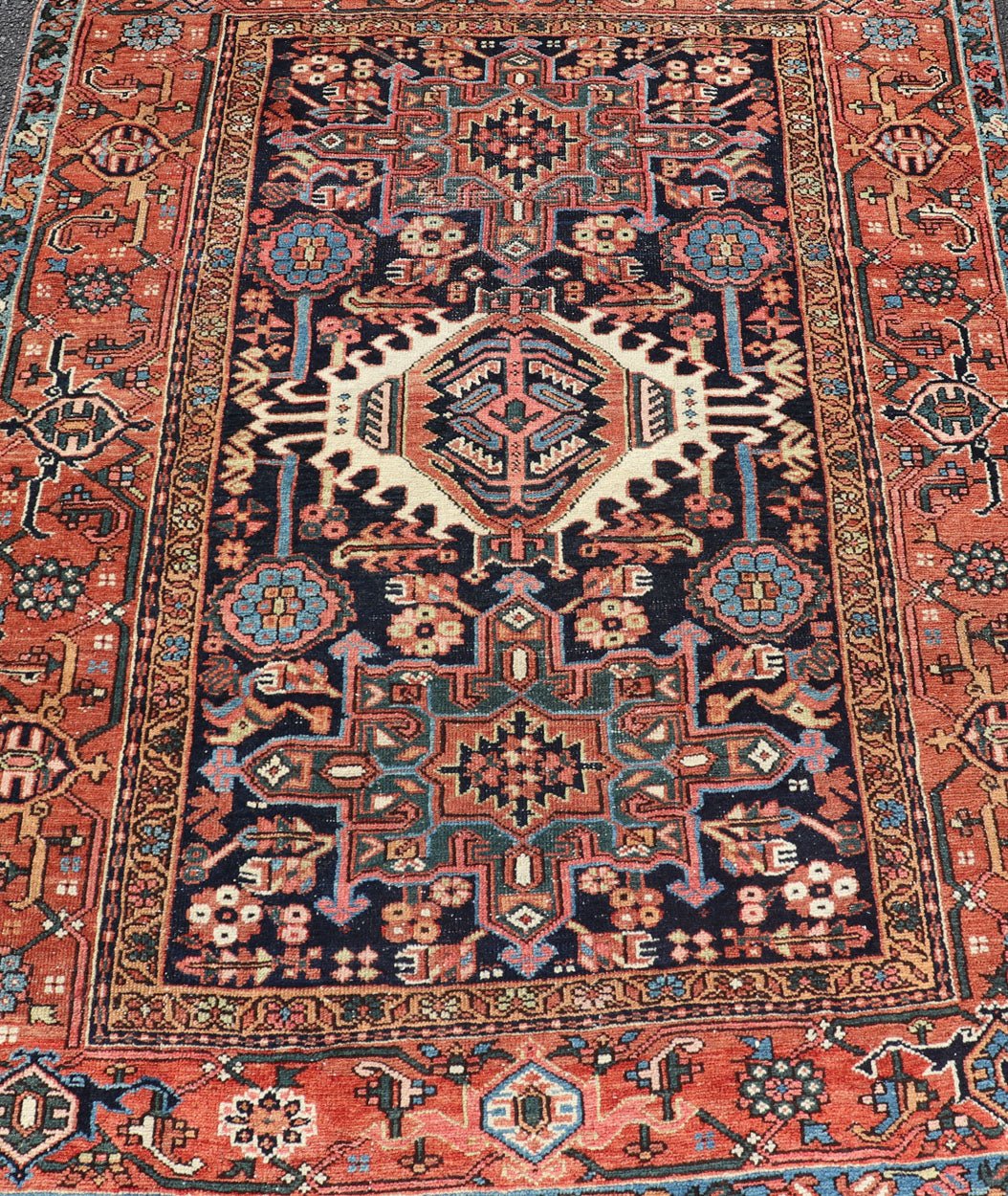 Antique Persian Heriz with Medallion Design in Ivory, Dark Blue & Jewel Tones This lovely Antique Heriz rug, hailing from northwestern Iran (circa 1920s), features a central medallion design surrounded by exquisitely defined geometric motifs. Th... - Keivan Woven ArtsEMB - 9641 - P13855 - 16055Rug