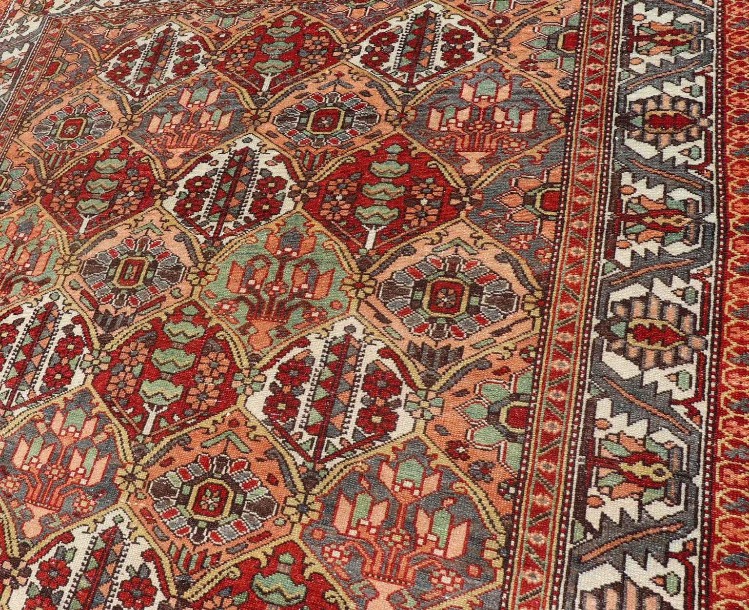 Antique Persian Diamond Garden Design Bakhtiari Rug in Multi Colors All - over diamond design antique Persian Bakhtiari Garden rug in coral, blue, green, ivory, tan, gold, rug EMB - 9643 - P13572, country of origin / type: Iran / Bakhtiari, circa 1920... - Keivan Woven ArtsEMB - 9643 - P13572 - 16067Rug
