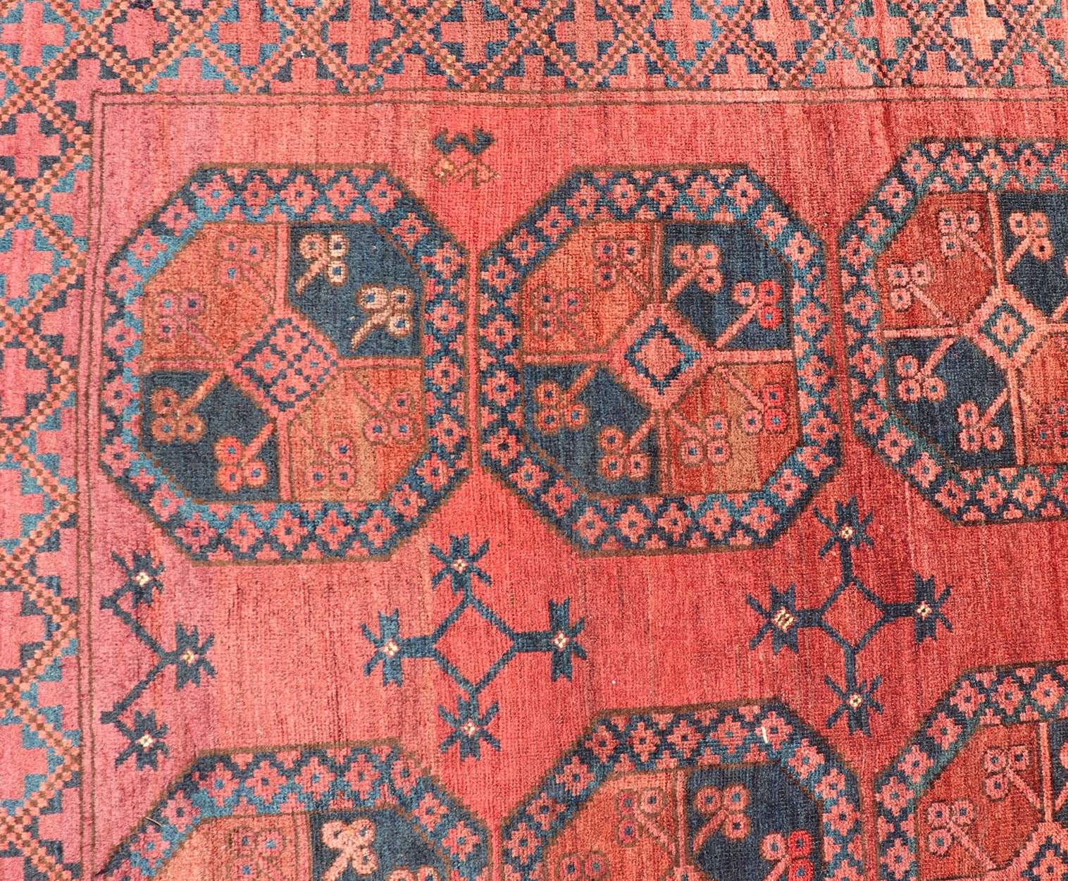 Hand - Knotted Turkomen Ersari Rug in Wool with Gul Design in Red, Orange and Blue This Turkomen Ersari rug has been hand - knotted in the finest wool. The rug features a repeating Gul design throughout the entirety of the rug, enclosed within a co... - Keivan Woven ArtsEMB - 9644 - P13547 - 16073Rug
