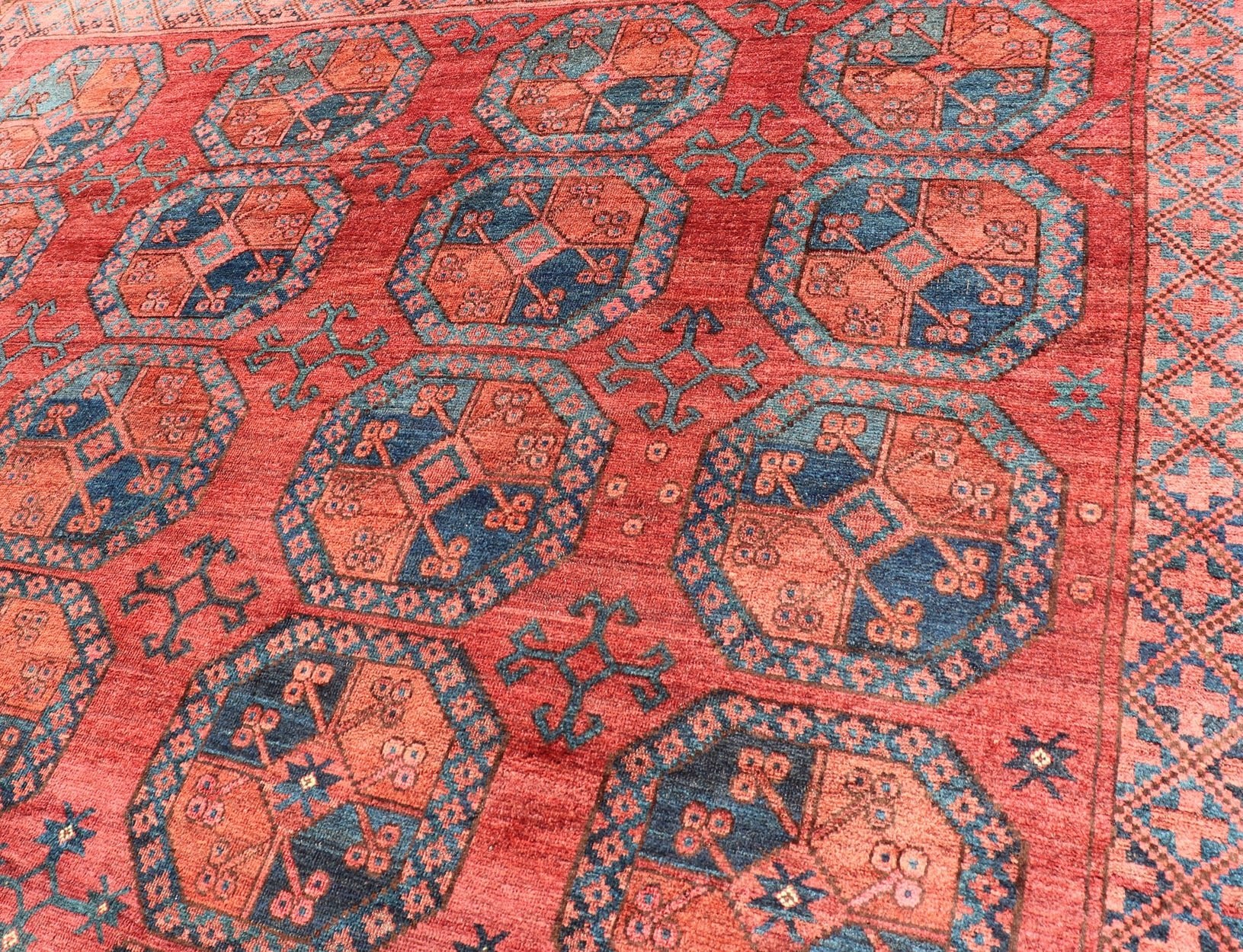 Hand - Knotted Turkomen Ersari Rug in Wool with Gul Design in Red, Orange and Blue This Turkomen Ersari rug has been hand - knotted in the finest wool. The rug features a repeating Gul design throughout the entirety of the rug, enclosed within a co... - Keivan Woven ArtsEMB - 9644 - P13547 - 16073Rug
