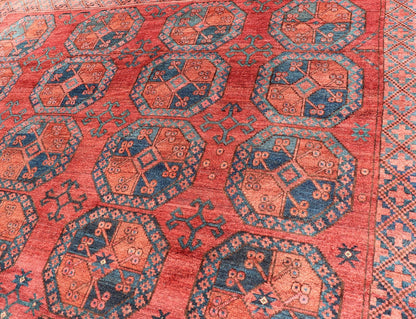 Hand - Knotted Turkomen Ersari Rug in Wool with Gul Design in Red, Orange and Blue This Turkomen Ersari rug has been hand - knotted in the finest wool. The rug features a repeating Gul design throughout the entirety of the rug, enclosed within a co... - Keivan Woven ArtsEMB - 9644 - P13547 - 16073Rug