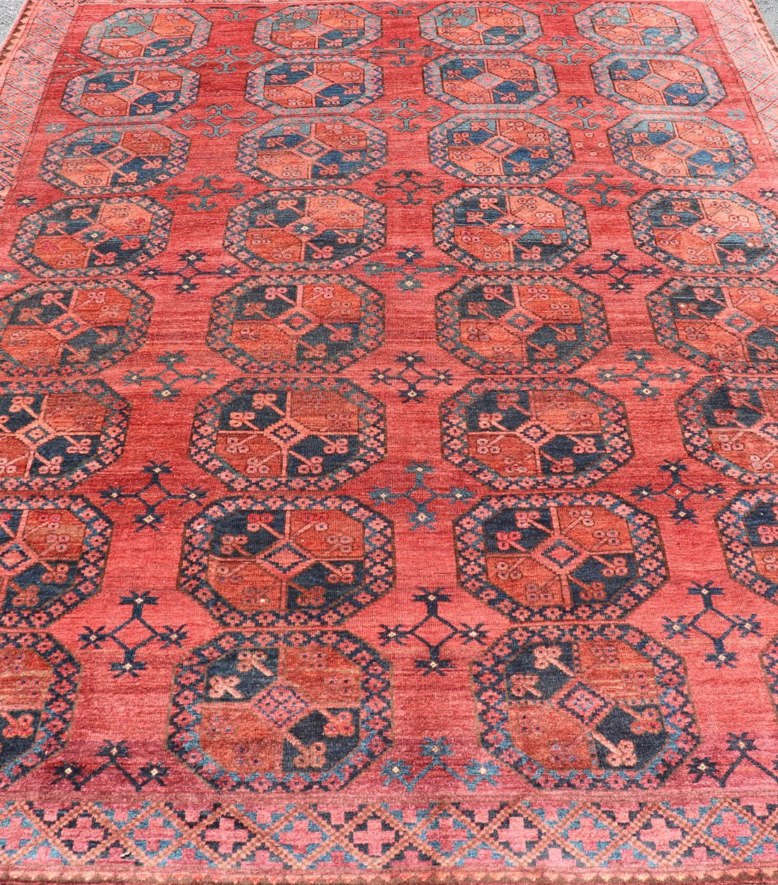 Hand - Knotted Turkomen Ersari Rug in Wool with Gul Design in Red, Orange and Blue This Turkomen Ersari rug has been hand - knotted in the finest wool. The rug features a repeating Gul design throughout the entirety of the rug, enclosed within a co... - Keivan Woven ArtsEMB - 9644 - P13547 - 16073Rug