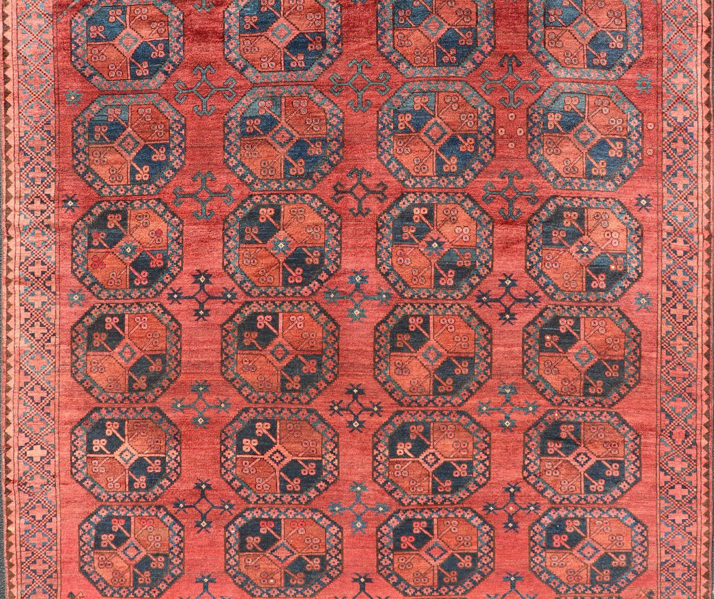 Hand - Knotted Turkomen Ersari Rug in Wool with Gul Design in Red, Orange and Blue This Turkomen Ersari rug has been hand - knotted in the finest wool. The rug features a repeating Gul design throughout the entirety of the rug, enclosed within a co... - Keivan Woven ArtsEMB - 9644 - P13547 - 16073Rug