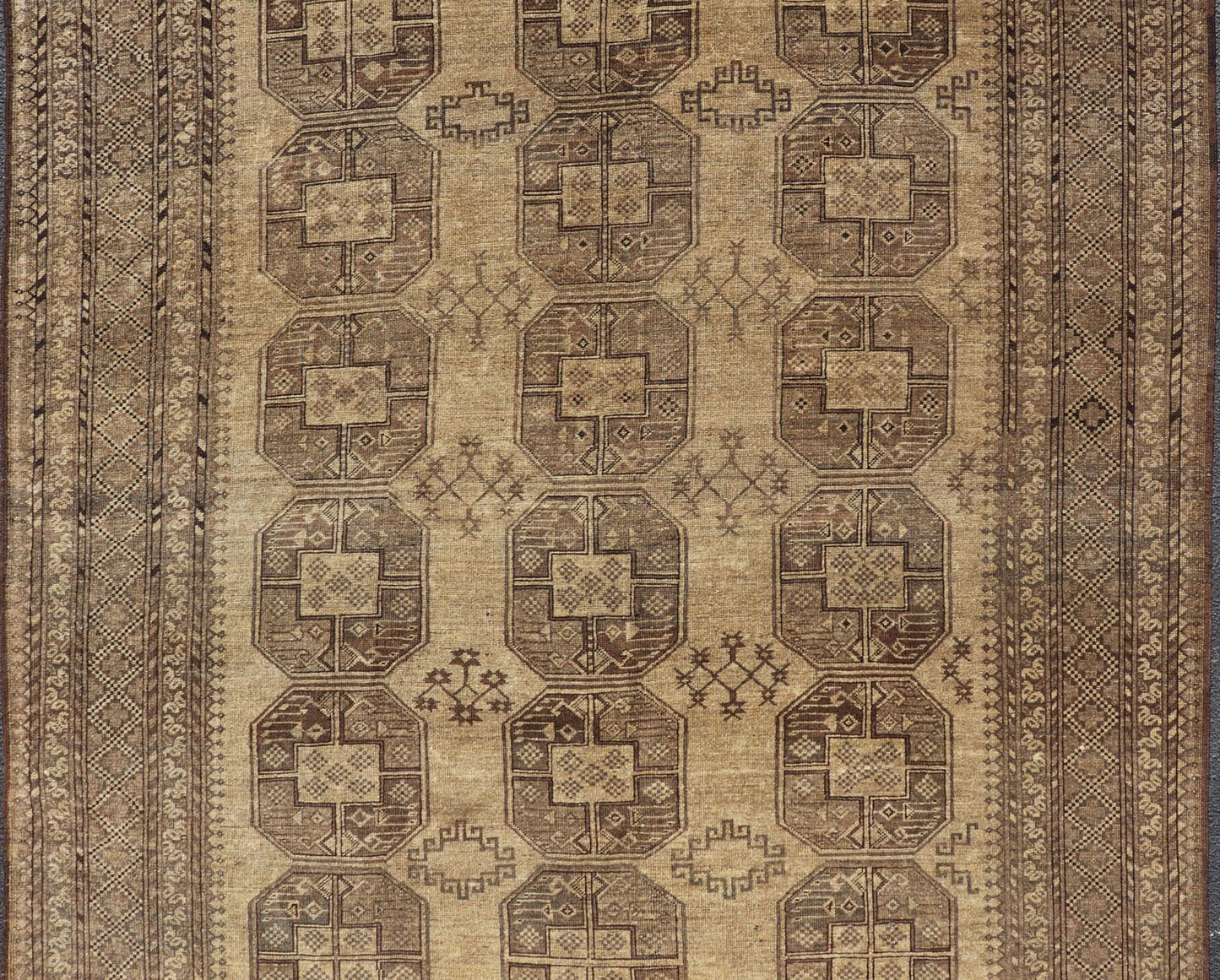 Hand - Knotted Turkomen Ersari Rug in Wool with Gul Design in Brown, Tan and Taupe This Turkomen Ersari rug has been hand - knotted in the finest wool. The rug features an all - over repeating Gul design throughout the entirety of the rug, enclosed w... - Keivan Woven ArtsEMB - 9647 - P13549 - 16091Rug