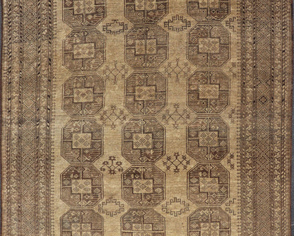 Hand - Knotted Turkomen Ersari Rug in Wool with Gul Design in Brown, Tan and Taupe This Turkomen Ersari rug has been hand - knotted in the finest wool. The rug features an all - over repeating Gul design throughout the entirety of the rug, enclosed w... - Keivan Woven ArtsEMB - 9647 - P13549 - 16091Rug