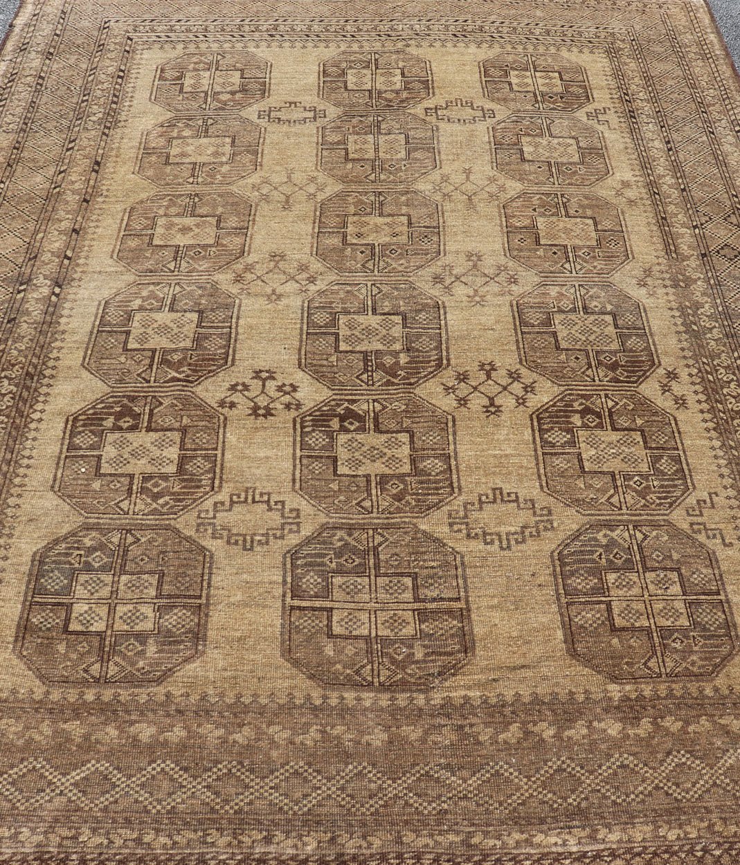 Hand - Knotted Turkomen Ersari Rug in Wool with Gul Design in Brown, Tan and Taupe This Turkomen Ersari rug has been hand - knotted in the finest wool. The rug features an all - over repeating Gul design throughout the entirety of the rug, enclosed w... - Keivan Woven ArtsEMB - 9647 - P13549 - 16091Rug