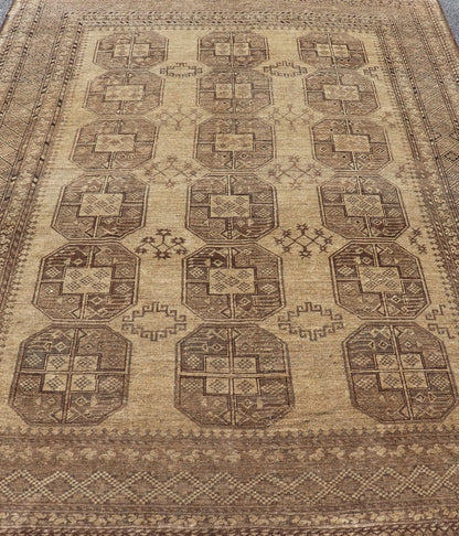 Hand - Knotted Turkomen Ersari Rug in Wool with Gul Design in Brown, Tan and Taupe This Turkomen Ersari rug has been hand - knotted in the finest wool. The rug features an all - over repeating Gul design throughout the entirety of the rug, enclosed w... - Keivan Woven ArtsEMB - 9647 - P13549 - 16091Rug
