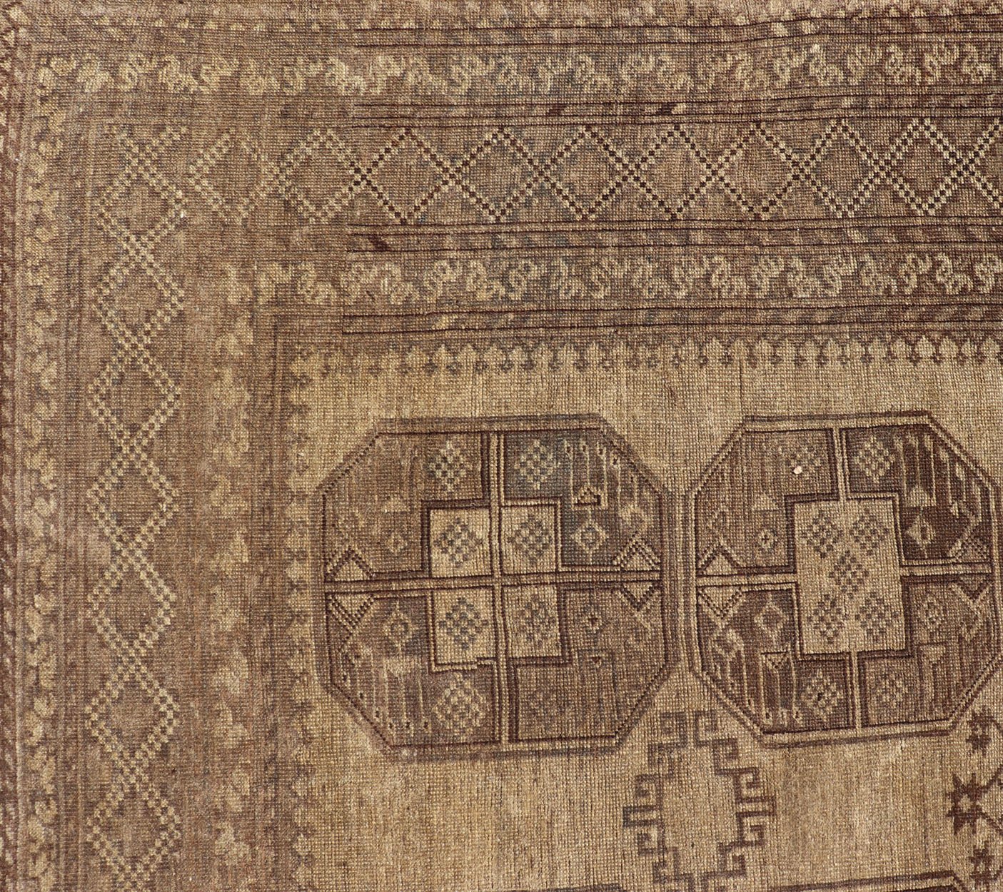 Hand - Knotted Turkomen Ersari Rug in Wool with Gul Design in Brown, Tan and Taupe This Turkomen Ersari rug has been hand - knotted in the finest wool. The rug features an all - over repeating Gul design throughout the entirety of the rug, enclosed w... - Keivan Woven ArtsEMB - 9647 - P13549 - 16091Rug