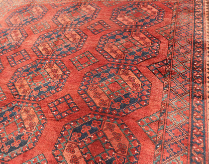 Early 20th Century Hand - Knotted Turkomen Ersari Rug in Wool with Gul Design This Ersari rug has been hand - knotted in the finest wool. The rug features a repeating Gul design throughout the entirety of the piece, enclosed within a complementary,... - Keivan Woven ArtsEMB - 9657 - P13540 - 16145Rug