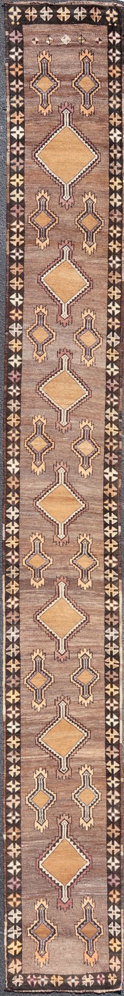 Long Vintage Turkish Kars Narrow Runner with Tribal Design. Long and Narrow Vintage Turkish Kars Runner with Tribal Design and Medallions in light purple, light orange, gray . Keivan Woven Arts / rug/ EMB - 9662 - P13548, country of origin / type: T... - Keivan Woven ArtsEMB - 9662 - P13548 - 16175Rug