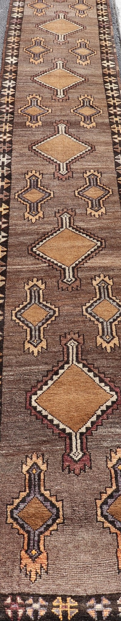 Long Vintage Turkish Kars Narrow Runner with Tribal Design. Long and Narrow Vintage Turkish Kars Runner with Tribal Design and Medallions in light purple, light orange, gray . Keivan Woven Arts / rug/ EMB - 9662 - P13548, country of origin / type: T... - Keivan Woven ArtsEMB - 9662 - P13548 - 16175Rug