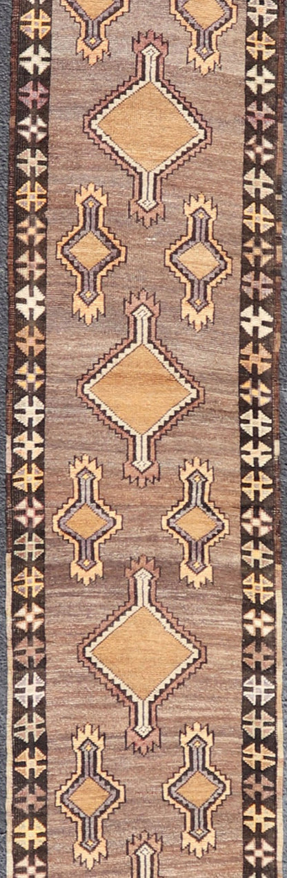 Long Vintage Turkish Kars Narrow Runner with Tribal Design. Long and Narrow Vintage Turkish Kars Runner with Tribal Design and Medallions in light purple, light orange, gray . Keivan Woven Arts / rug/ EMB - 9662 - P13548, country of origin / type: T... - Keivan Woven ArtsEMB - 9662 - P13548 - 16175Rug