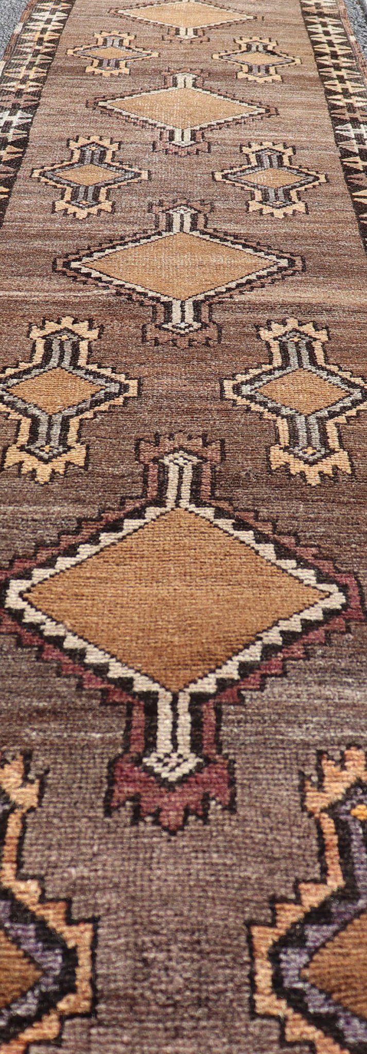 Long Vintage Turkish Kars Narrow Runner with Tribal Design. Long and Narrow Vintage Turkish Kars Runner with Tribal Design and Medallions in light purple, light orange, gray . Keivan Woven Arts / rug/ EMB - 9662 - P13548, country of origin / type: T... - Keivan Woven ArtsEMB - 9662 - P13548 - 16175Rug
