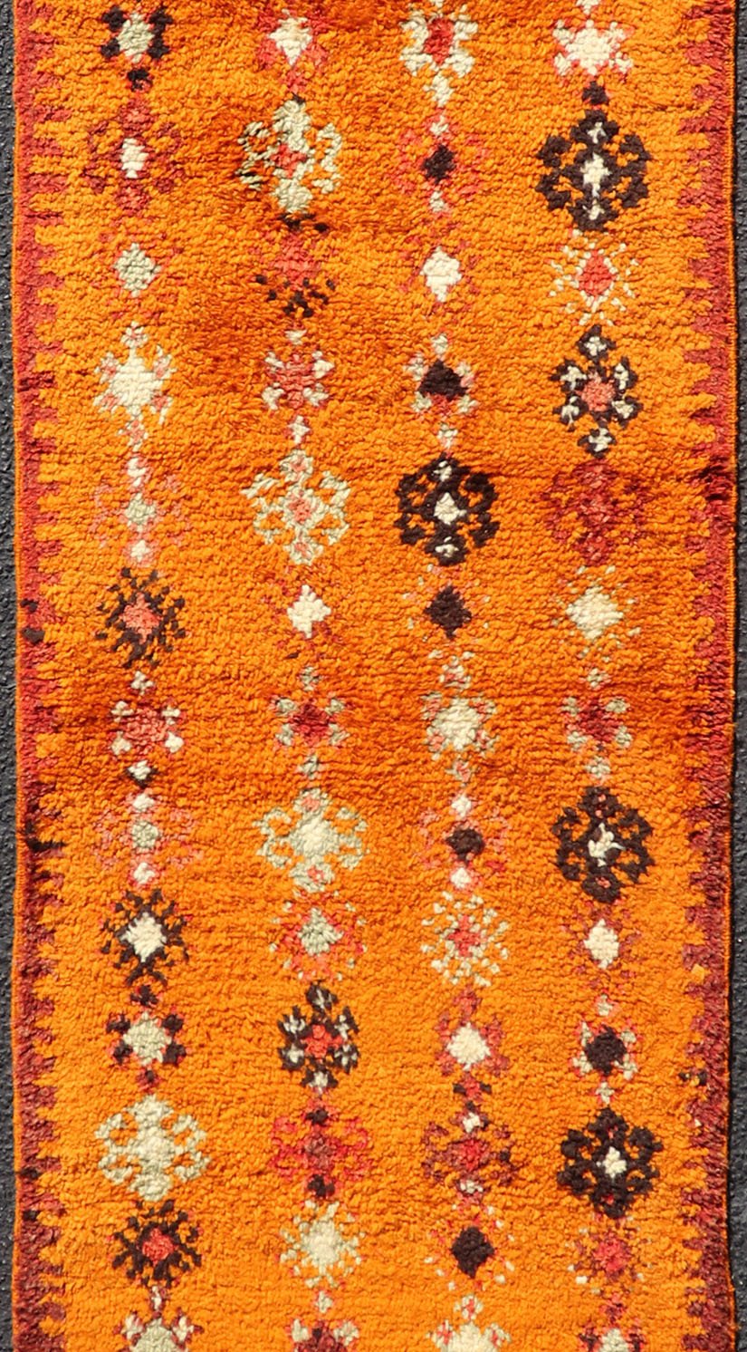 Vintage Moroccan Runner with Sub - Geometric Motifs in Saffron, Gold and Orange This lovely Vintage Moroccan Carpet (circa 1940s), features an all - over sub - geometric design rendered in Saffron, Ivory, Brown and variations of Red, Green, Gold & Ora... - Keivan Woven ArtsEMB - 9667 - P13564 - 16193Rug