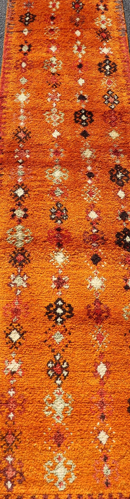 Vintage Moroccan Runner with Sub - Geometric Motifs in Saffron, Gold and Orange This lovely Vintage Moroccan Carpet (circa 1940s), features an all - over sub - geometric design rendered in Saffron, Ivory, Brown and variations of Red, Green, Gold & Ora... - Keivan Woven ArtsEMB - 9667 - P13564 - 16193Rug