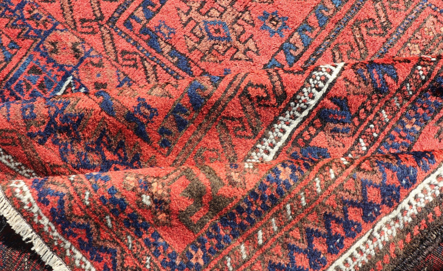 Antique Baluch Tribal Rug with All - Over Geometric Medallion Design in Red. Keivan Woven Arts, rug EMB - 9672 - P13589; country of origin / type: iran / Baluch, circa 1920s. This Antique Baluch Rug has been hand - knotted and features an impressive all... - Keivan Woven ArtsEMB - 9672 - P13589 - 16253Rug