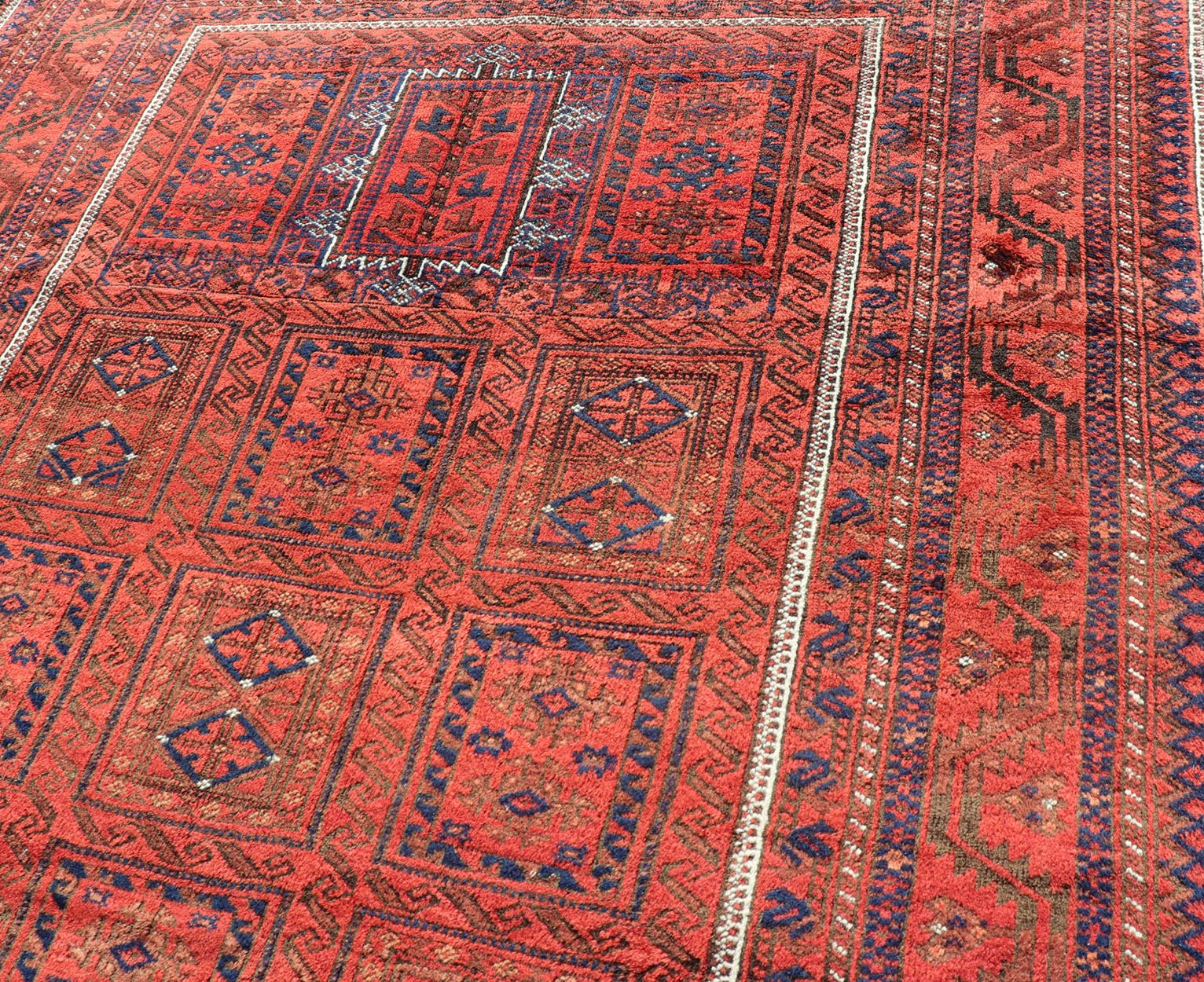 Antique Baluch Tribal Rug with All - Over Geometric Medallion Design in Red. Keivan Woven Arts, rug EMB - 9672 - P13589; country of origin / type: iran / Baluch, circa 1920s. This Antique Baluch Rug has been hand - knotted and features an impressive all... - Keivan Woven ArtsEMB - 9672 - P13589 - 16253Rug