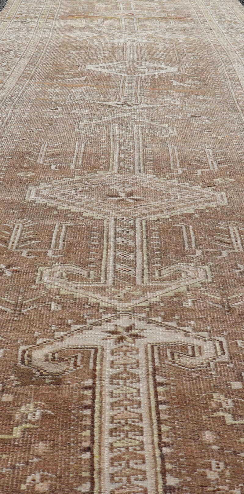 Measures: 3'9 x 14'3 Long Persian Heriz Runner with Central Medallions in Brown, Maroon, Tan & Red. Keivan Woven Arts / rug EMB - 9675 - 13537, country of origin / type: Iran / Heriz, circa 1920. This magnificent long Persian Heriz runner bears ... - Keivan Woven ArtsEMB - 9675 - 13537 - 16223Rug