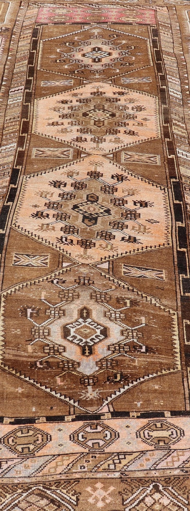 Vintage Hand - Knotted Turkish Kars Galley Rug in Wool with Medallion Design This vintage Turkish Kars gallery rug has been hand - knotted in wool and features a sub - geometric medallion design rendered in multicolor. A complementary, multi - tiered b... - Keivan Woven ArtsEMB - 9676 - P13554 - 16229Rug