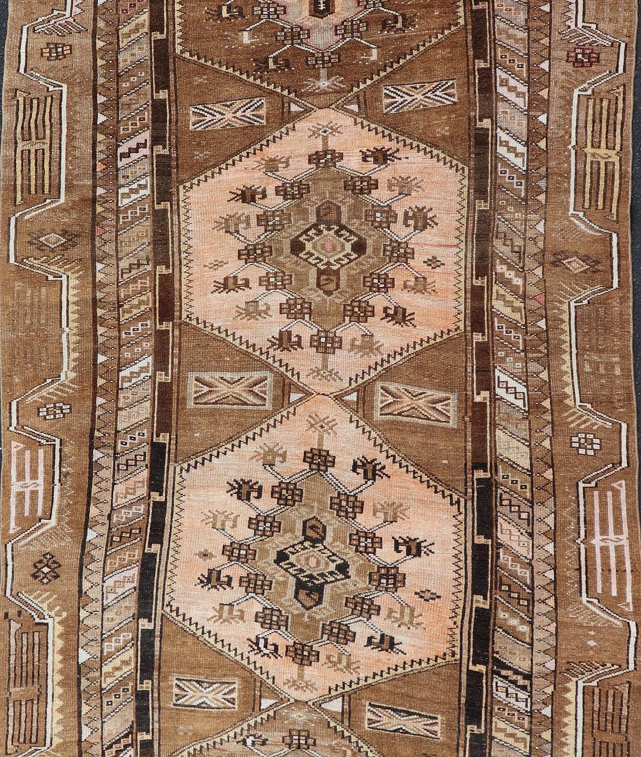 Vintage Hand - Knotted Turkish Kars Galley Rug in Wool with Medallion Design This vintage Turkish Kars gallery rug has been hand - knotted in wool and features a sub - geometric medallion design rendered in multicolor. A complementary, multi - tiered b... - Keivan Woven ArtsEMB - 9676 - P13554 - 16229Rug
